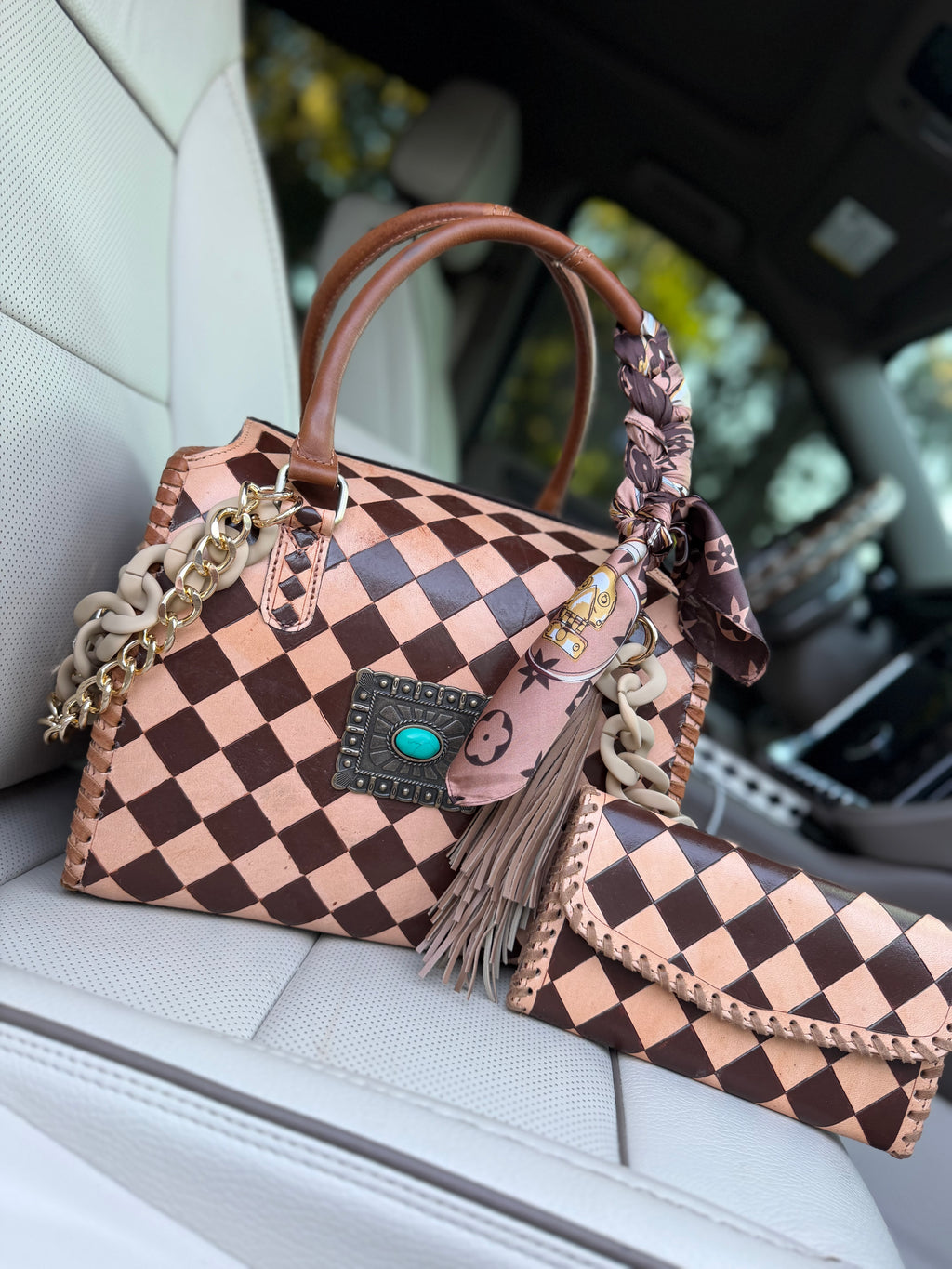 “Cowgirl Couture” peanut butter checker tooled leather speedy (L) by the Painted Porches