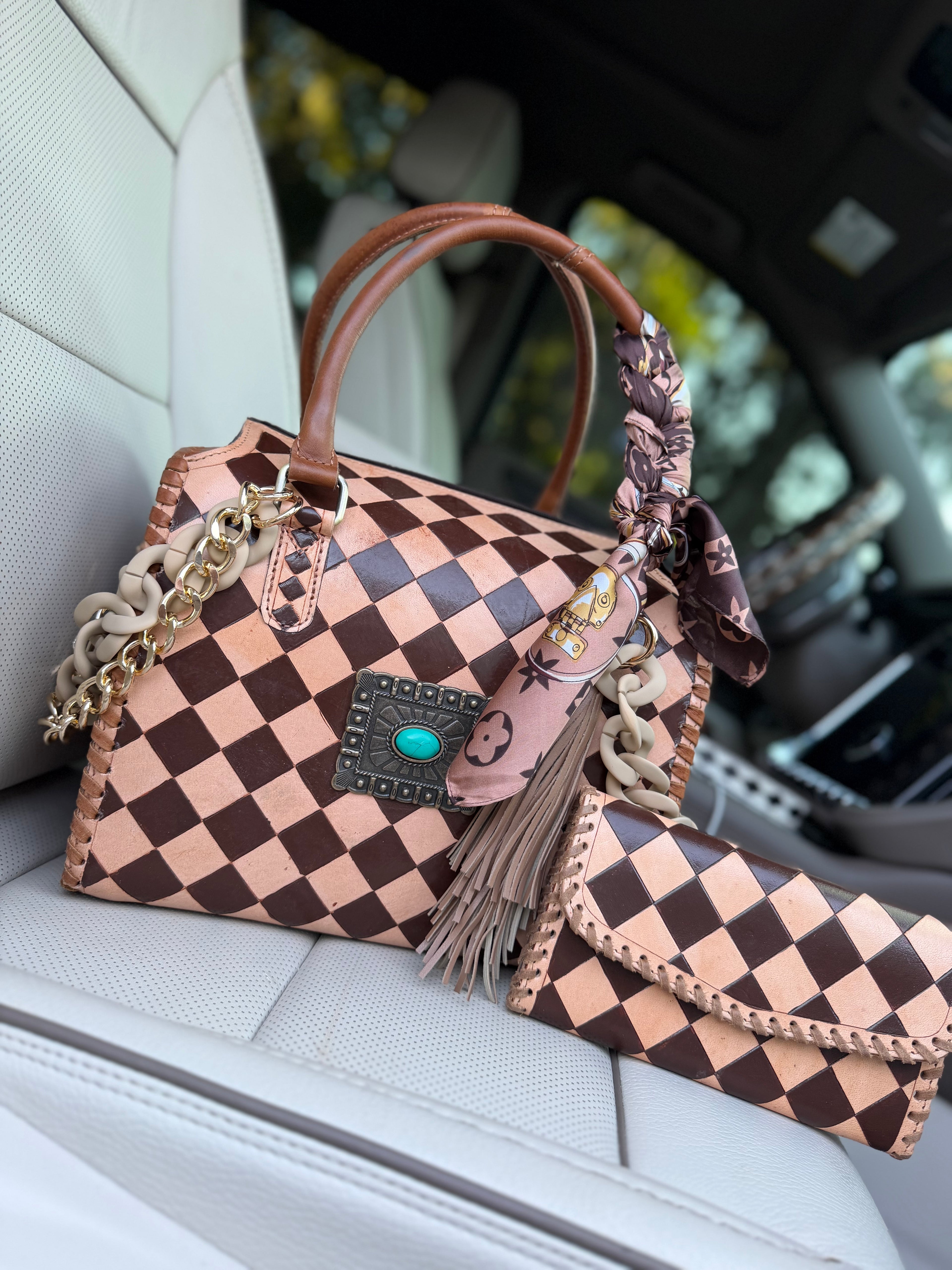 “Cowgirl Couture” peanut butter checker tooled leather speedy (L) by the Painted Porches