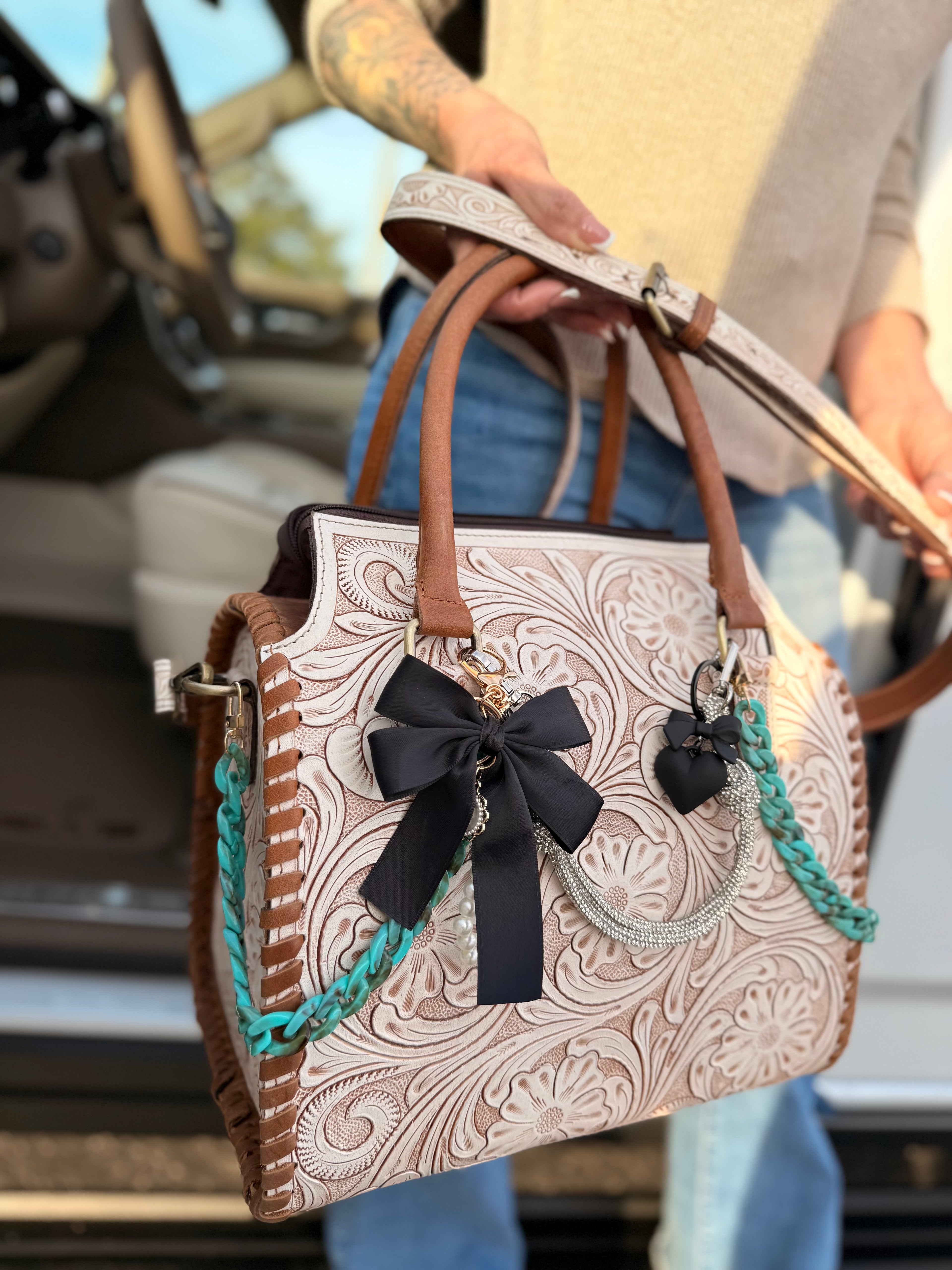 "Outlaw Heiress" - white tooled speedy (L) tote, teal/black accents