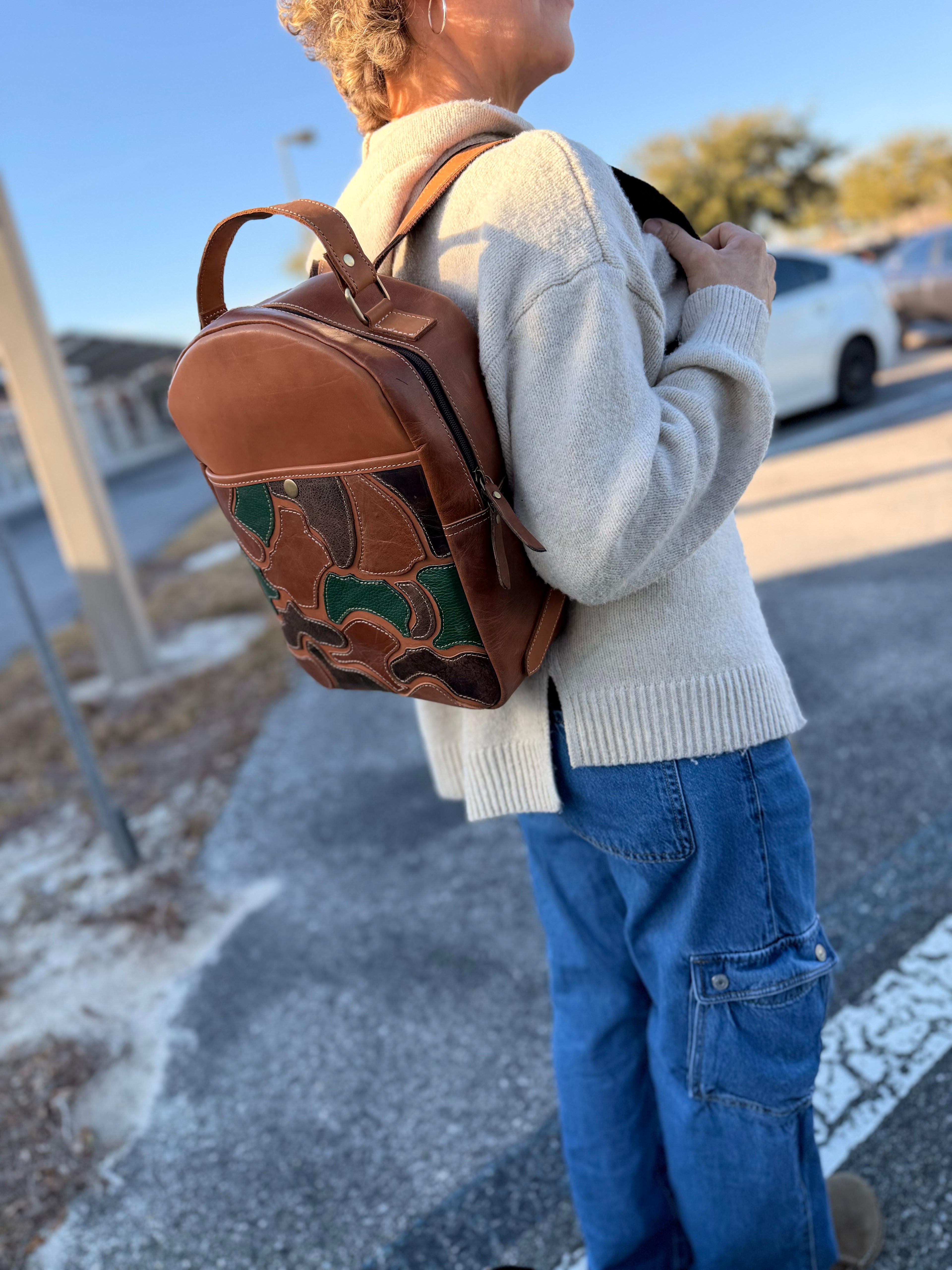 The “Hunter” camo leather bookbag by the Painted Porches