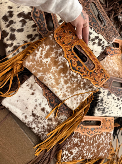 Tooled leather cross body bags comes with long strap