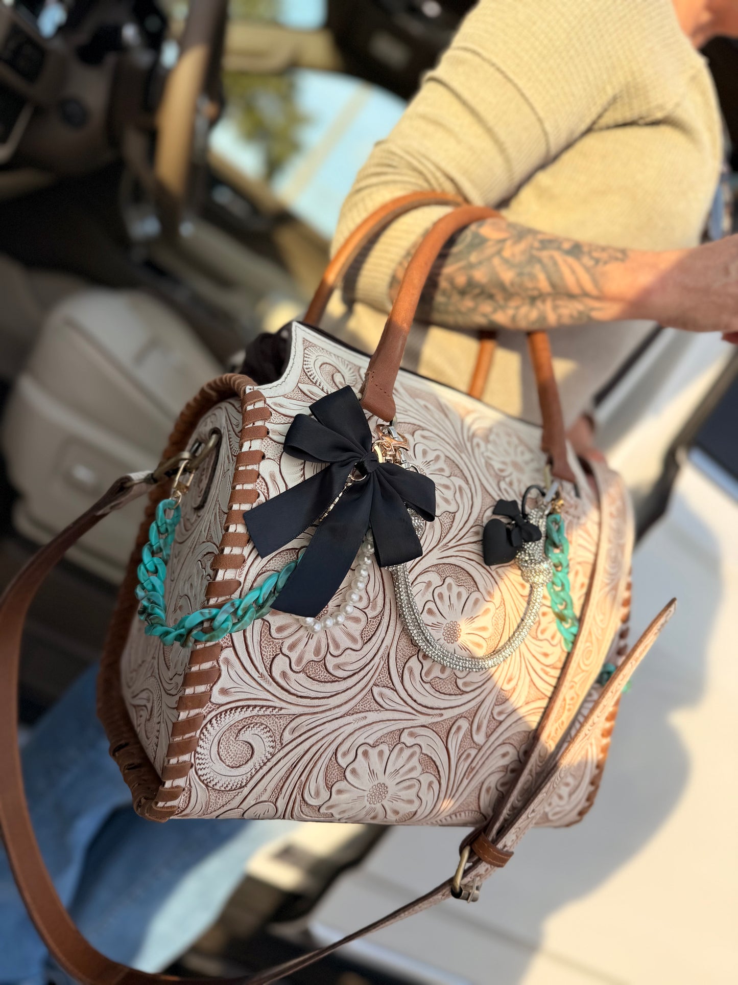 "Outlaw Heiress" - white tooled speedy (L) tote, teal/black accents