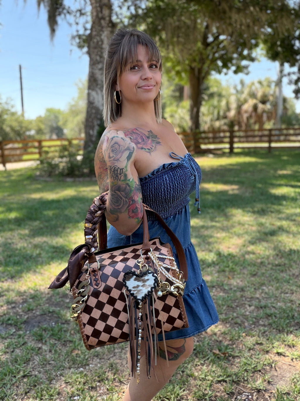 “Champagne and Spurs” peanut butter checker tooled leather speedy (L) by the Painted Porches