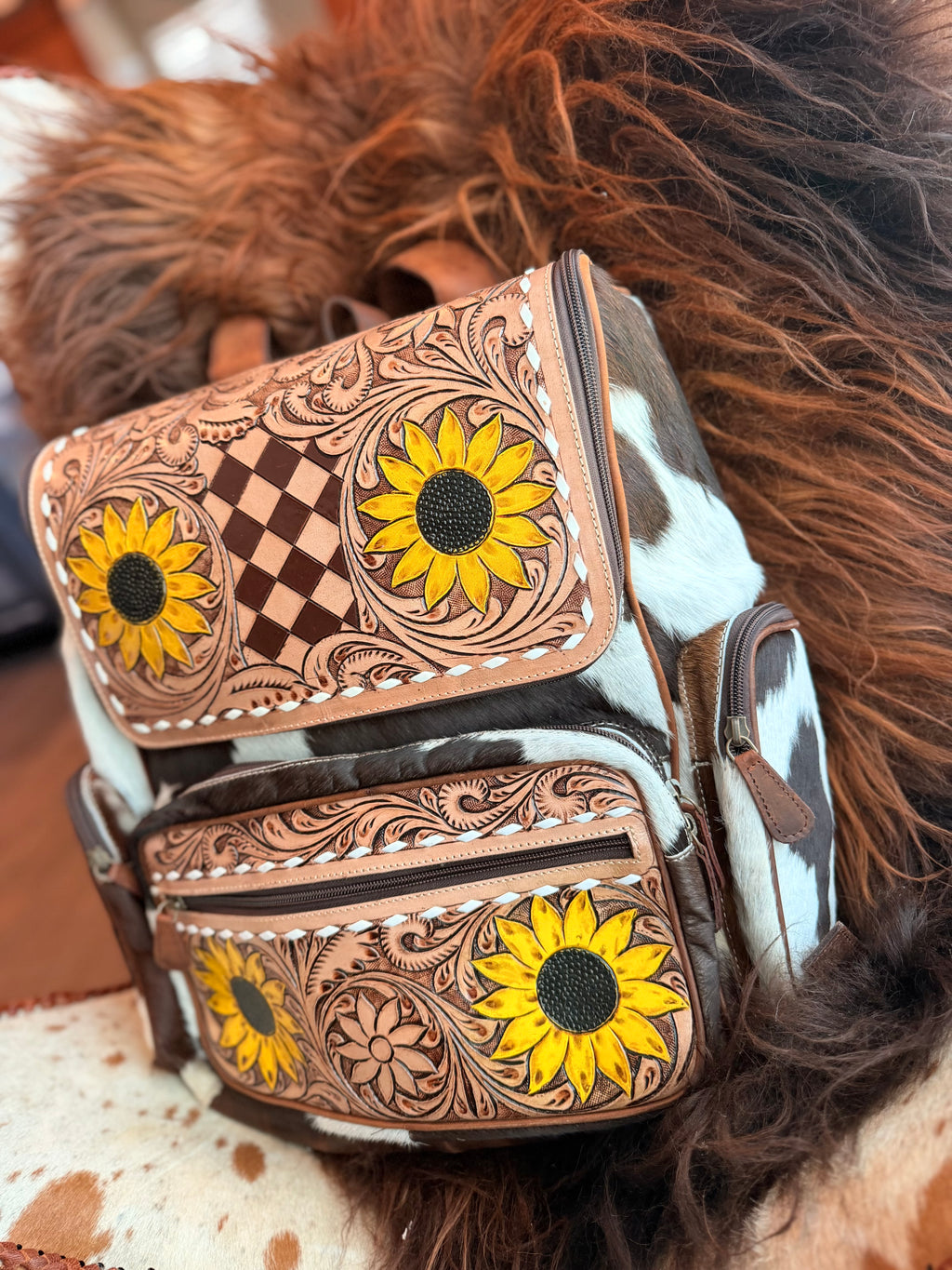 Tooled leather bookbag