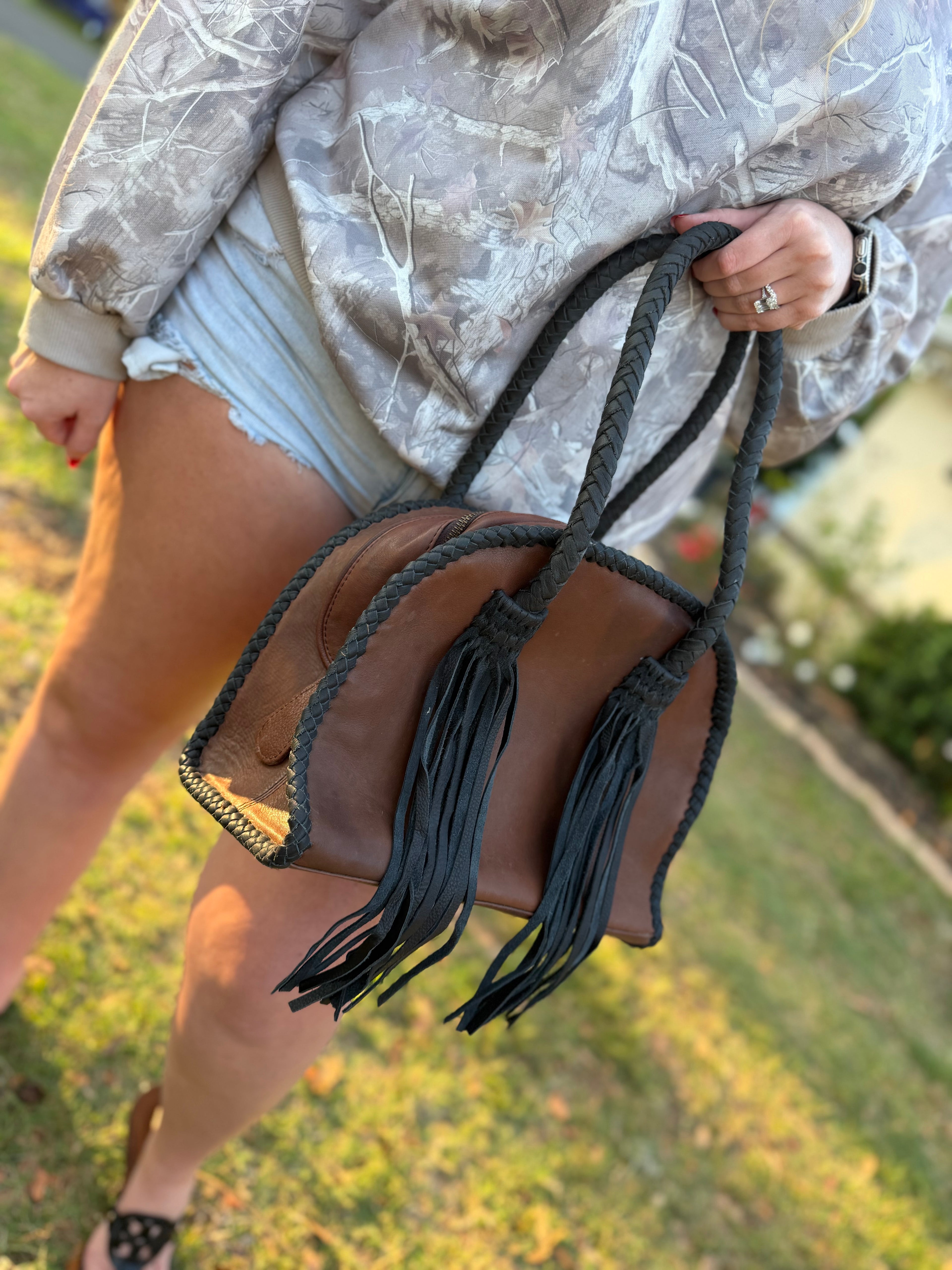 Leather purse with black fringe