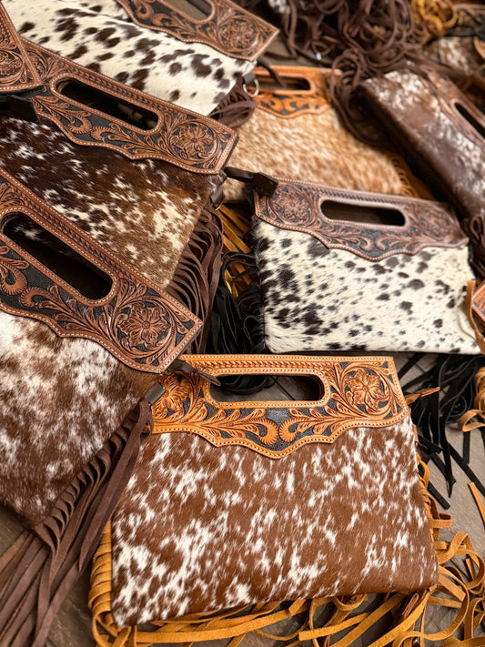 Tooled leather cross body bags comes with long strap