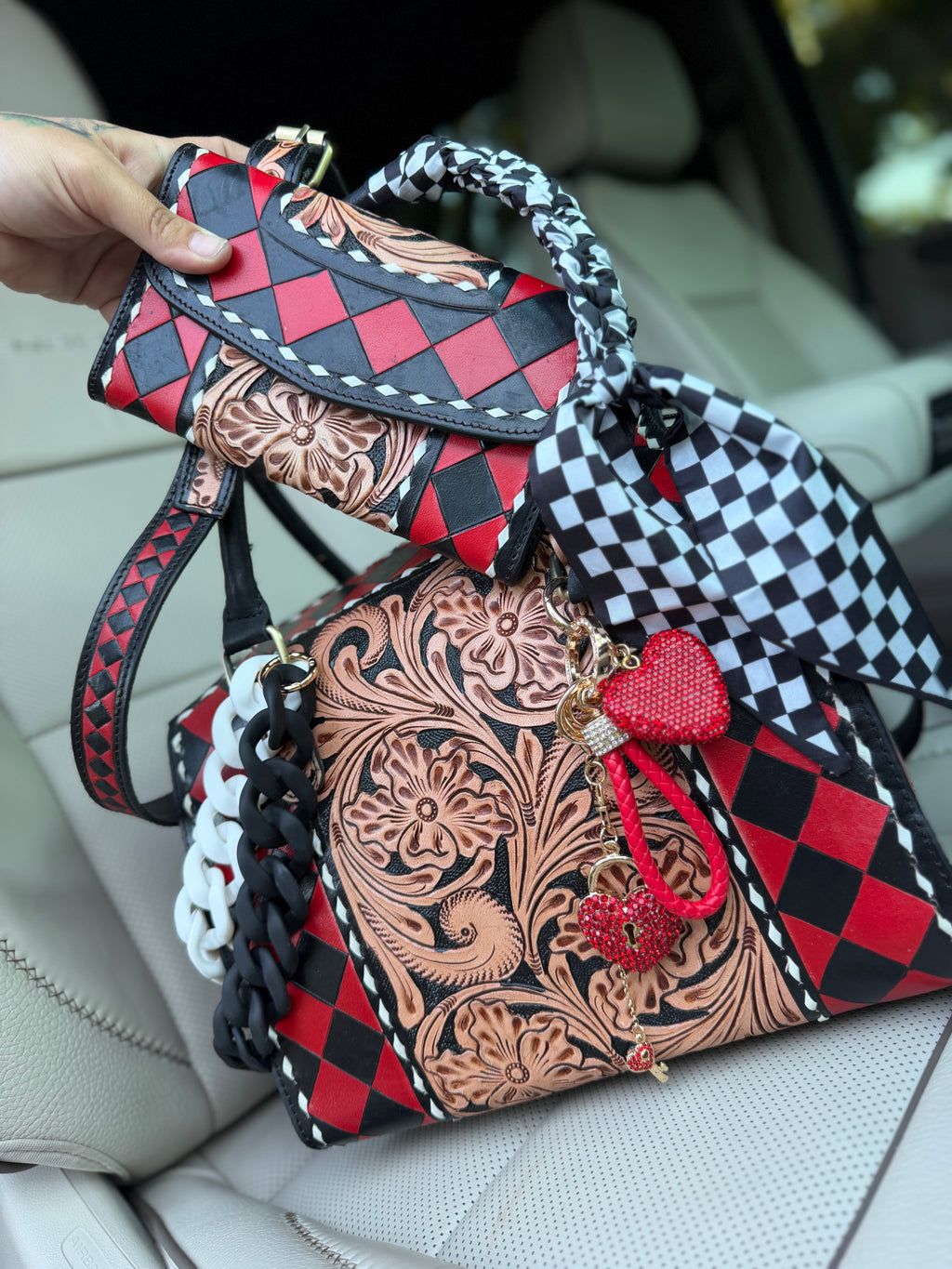 “Harlequin Heiress” red/black check and tooled leather speedy (L) by the Painted Porches