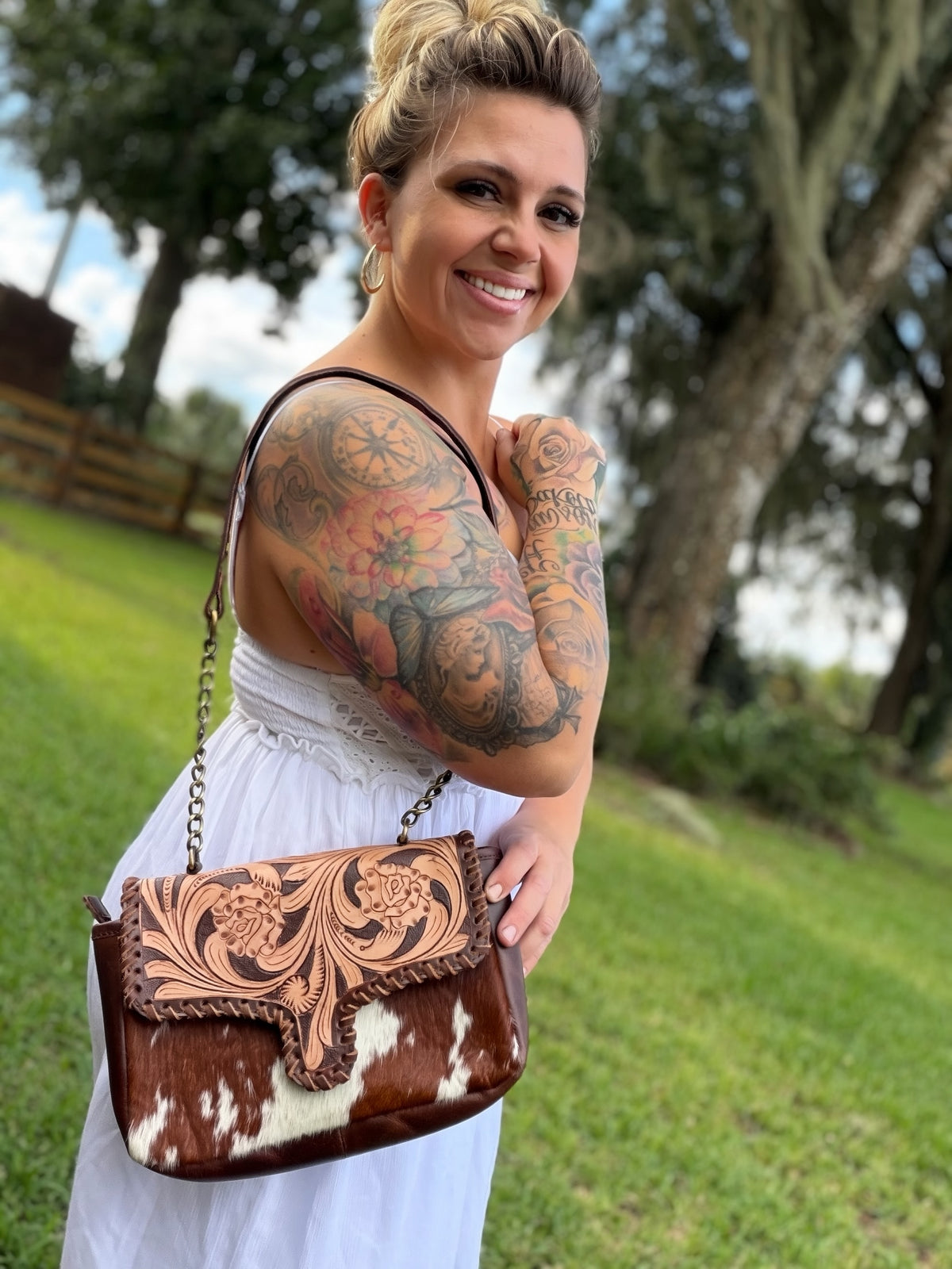 Tooled leather and cowhide crossbody bag