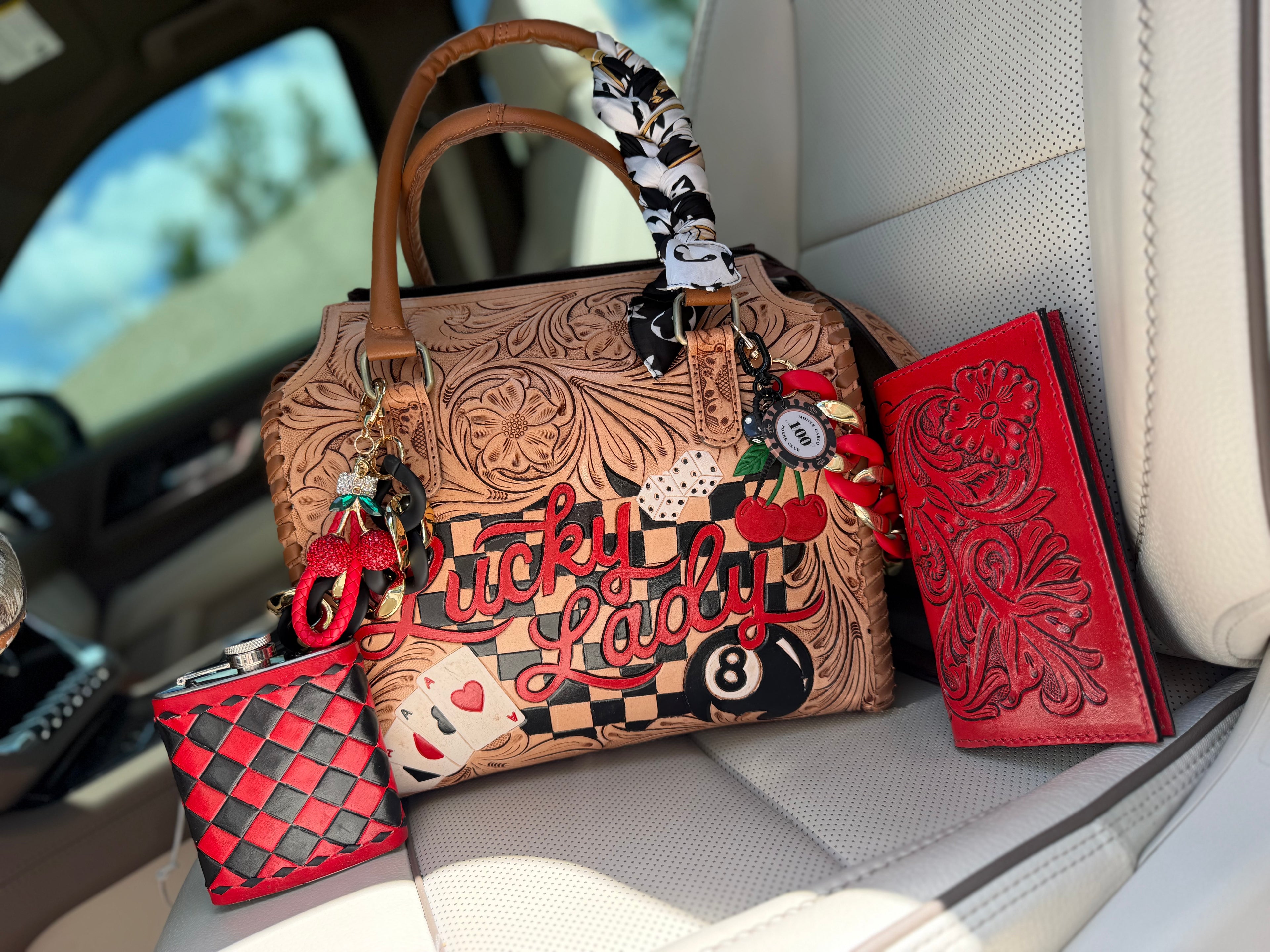 “The Outlaw Gambler” tooled leather speedy (L) by the Painted Porches