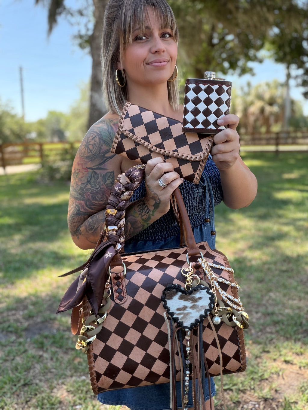 “Champagne and Spurs” peanut butter checker tooled leather speedy (L) by the Painted Porches
