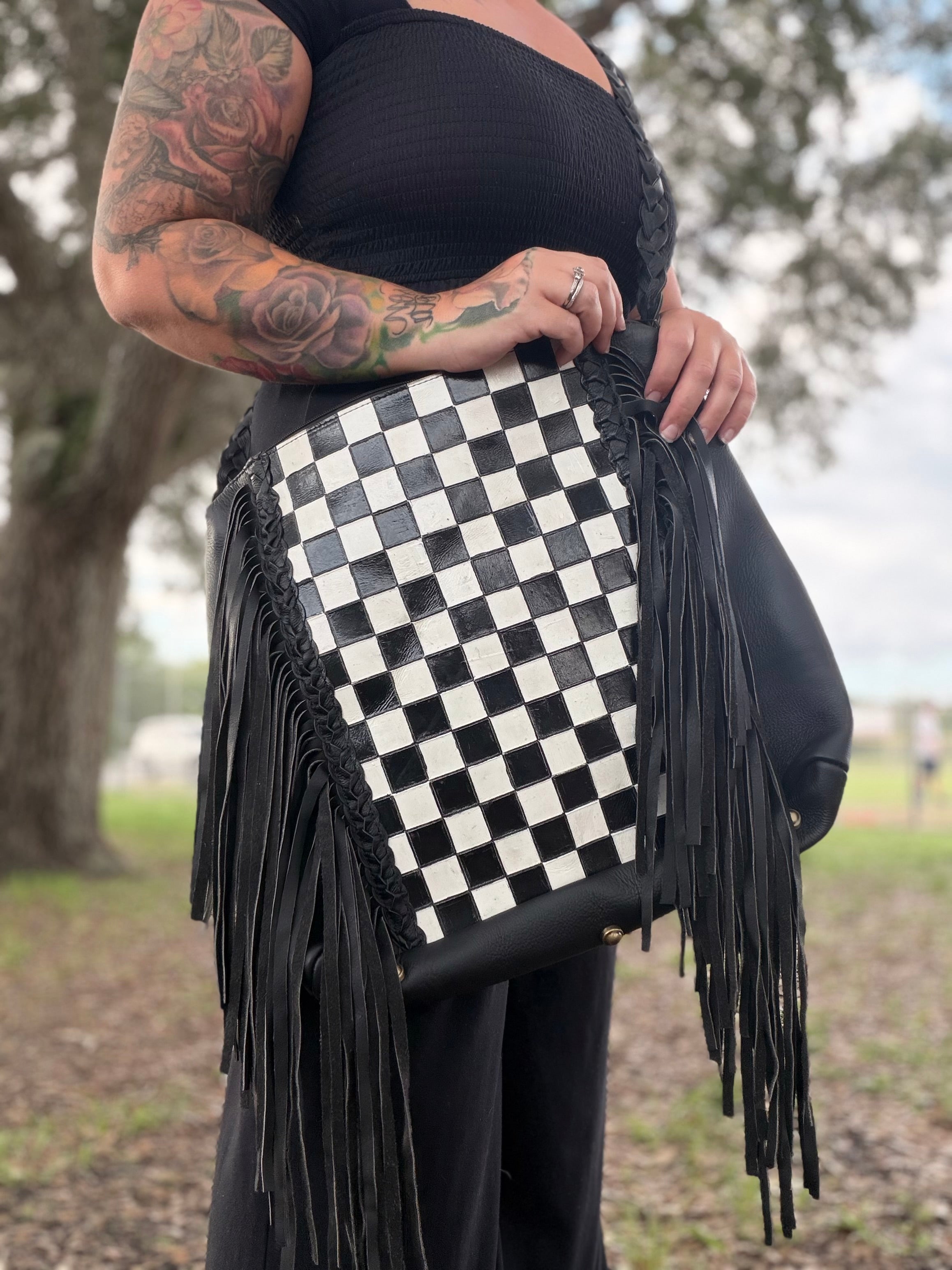 Checker tooled leather hobo bag with fringe