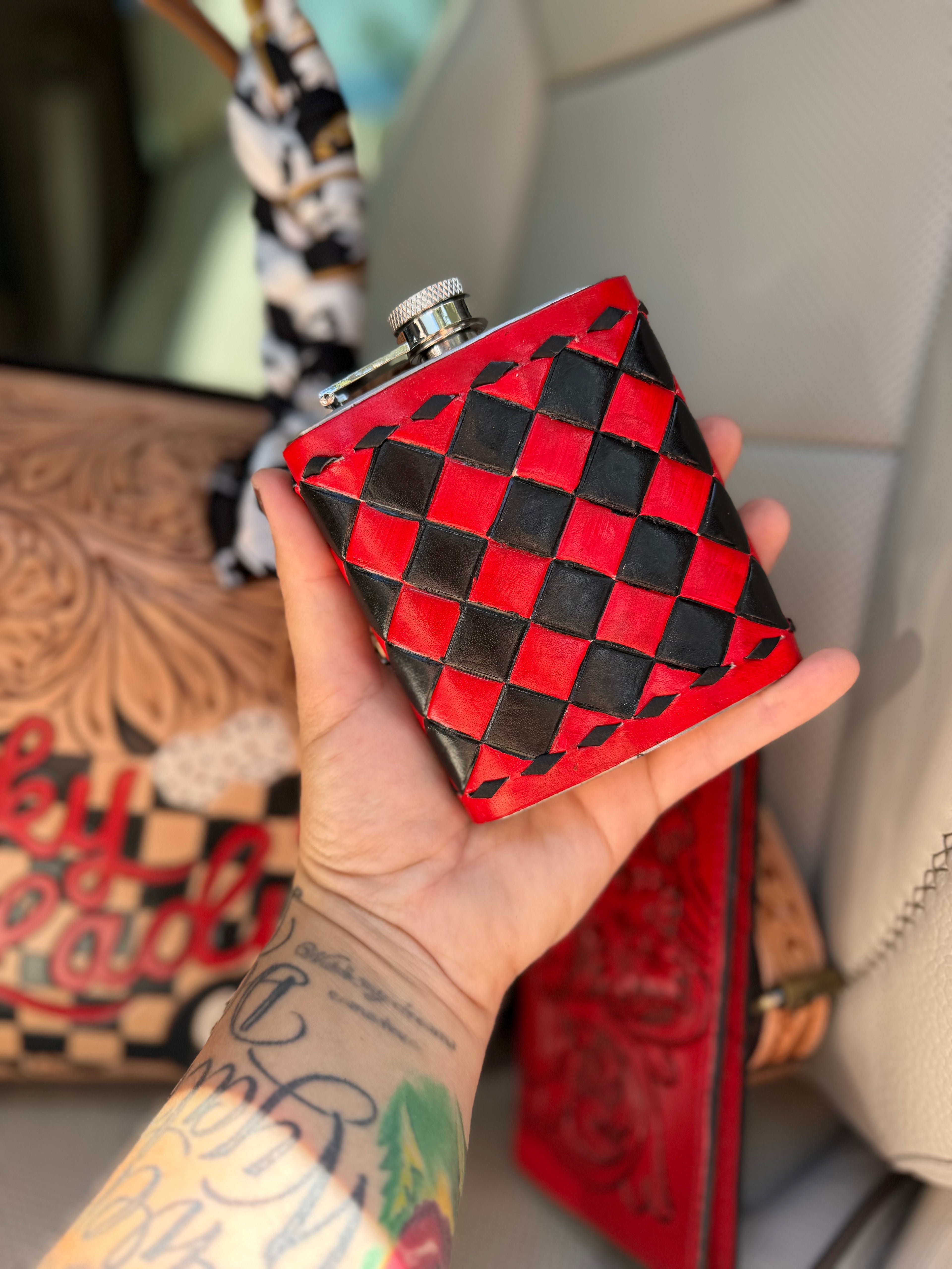 “The Outlaw Gambler” tooled leather speedy (L) by the Painted Porches