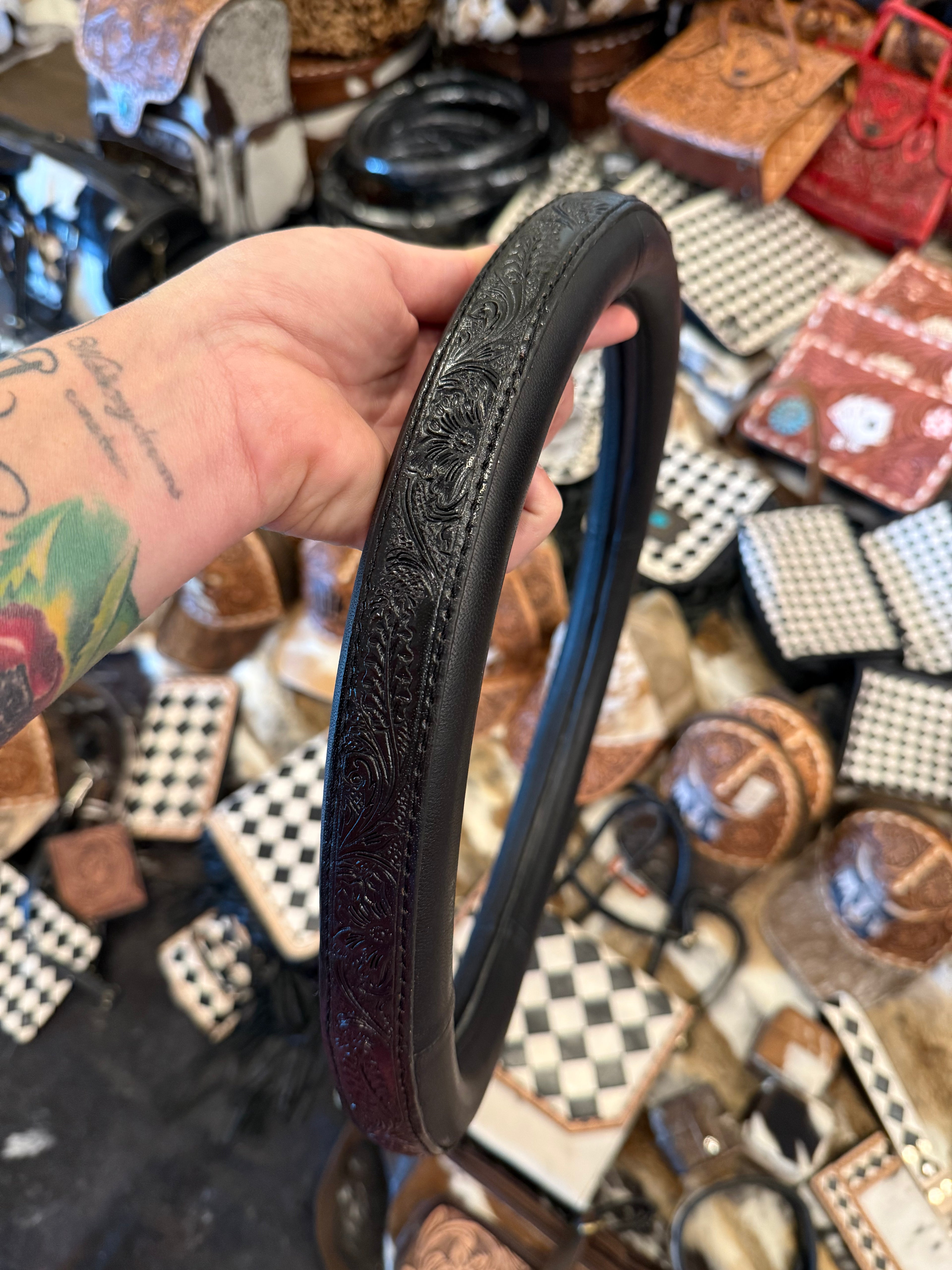 Tooled black steering wheel cover