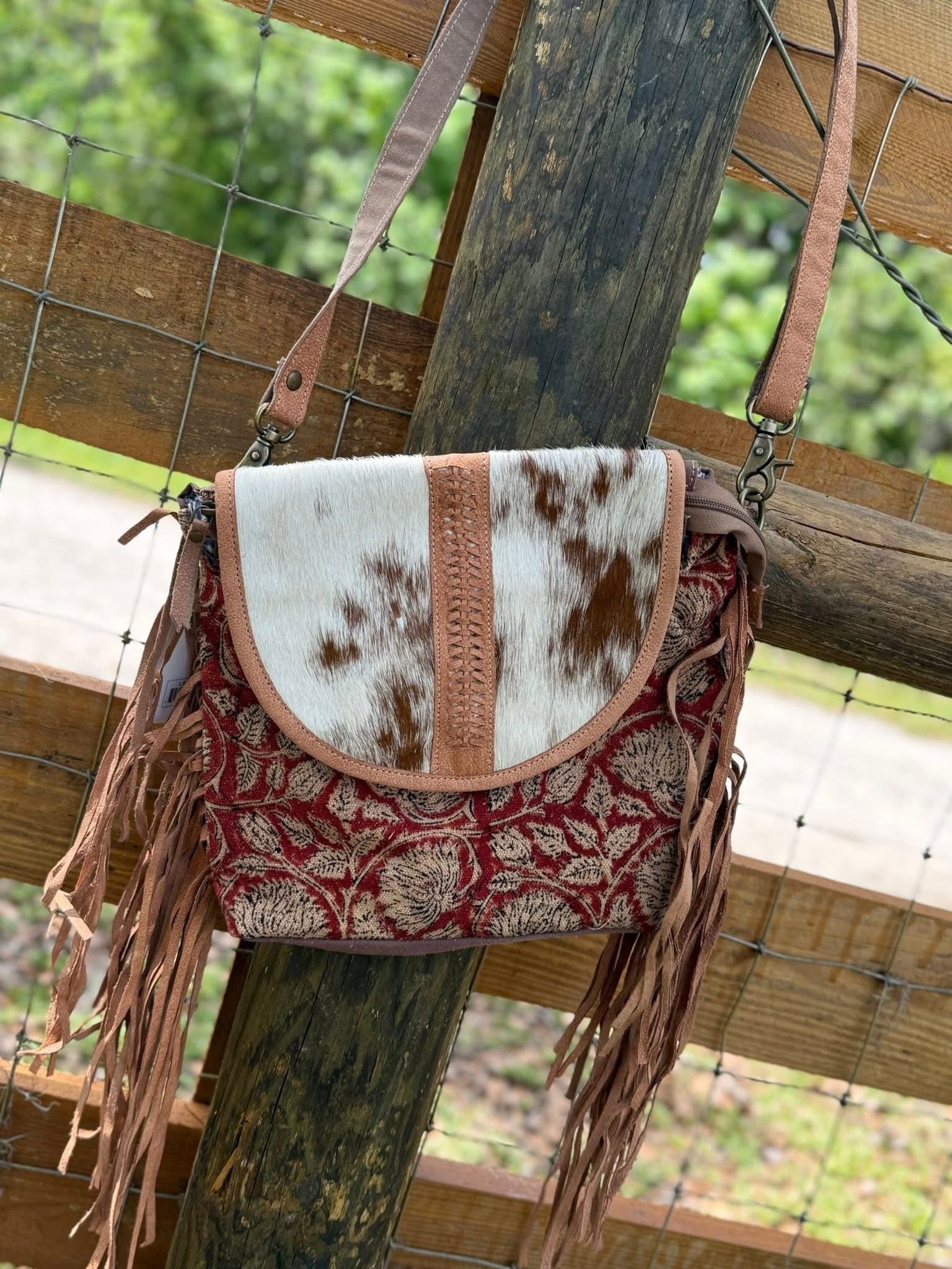 Cowhide and fringe Purse