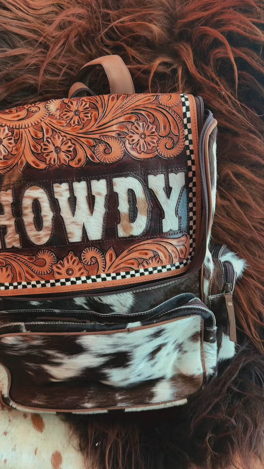 Tooled leather bookbag