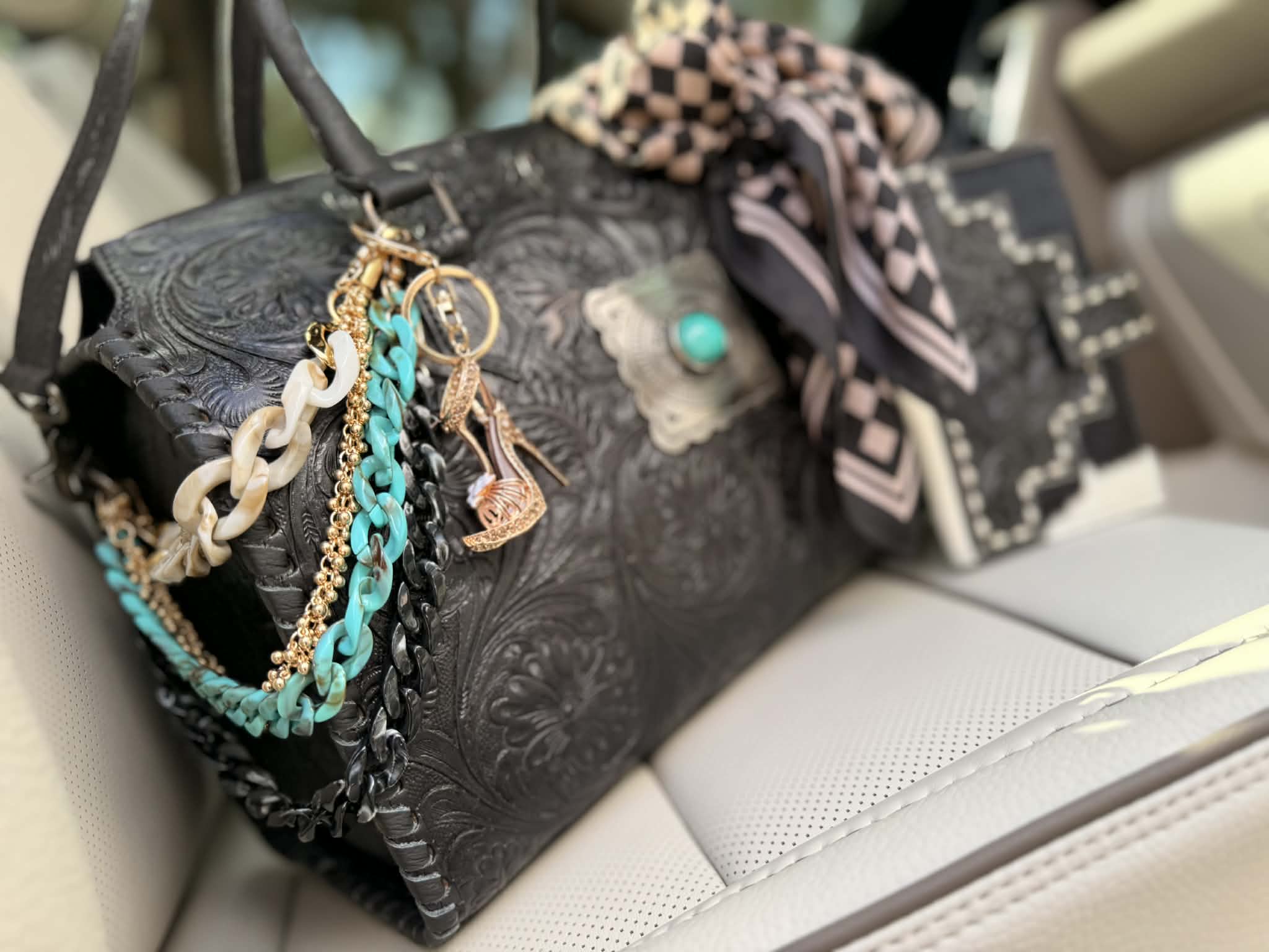 "Turquoise after Dark" - black tooled leather speedy duffle